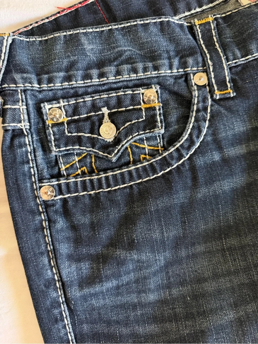True Religion men’s street cut Jeans in Dark Indigo with Yellow Stitching